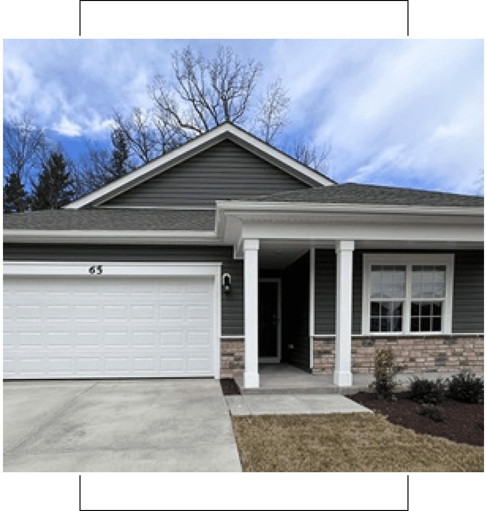 A modern single-story house with a two-car garage and front porch.